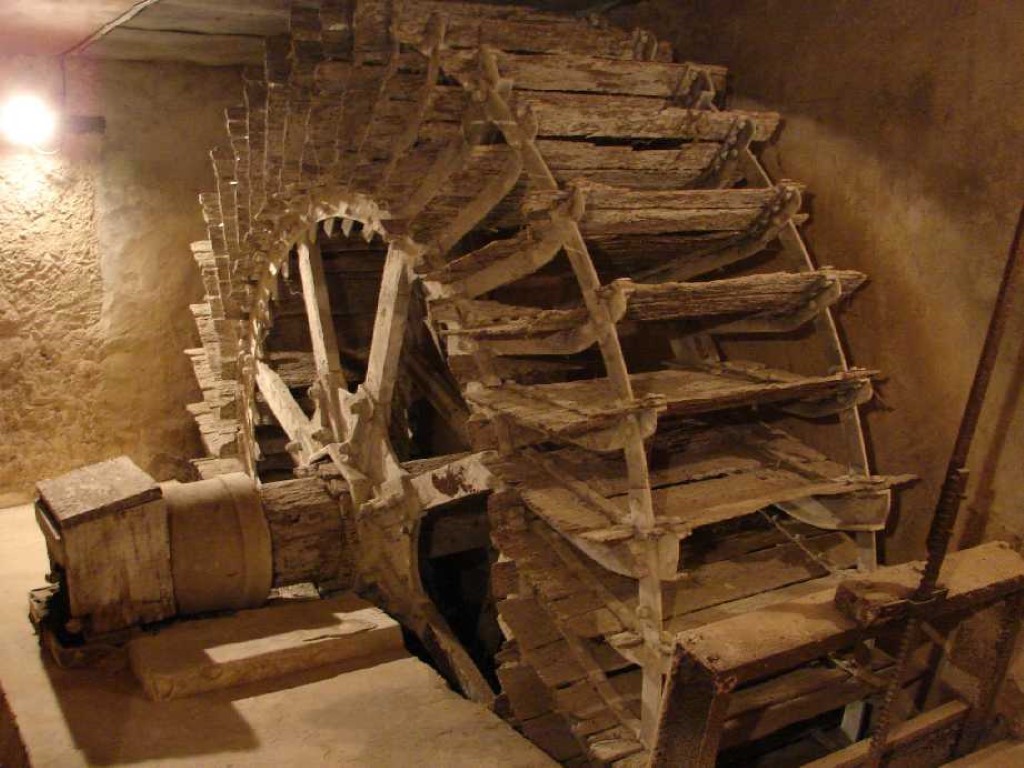 Original 18th century wooden waterwheel preserved in chamber beneath Moulin St Blaise, Chahaignes, Sarthe