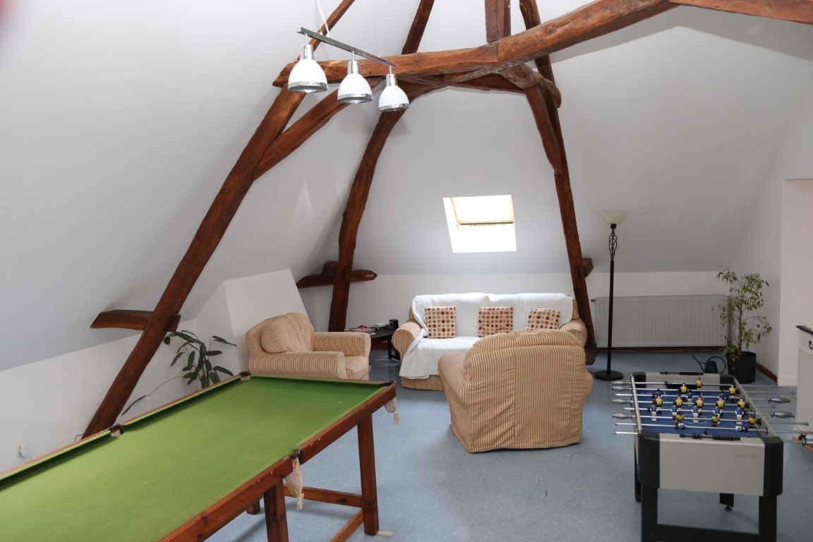 B&B guest games lounge with pool table, foosball and exposed medieval beams at Le Moulin St Blaise