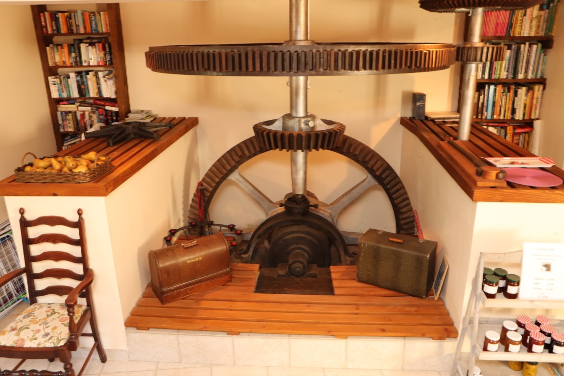 Original 18th century iron mill gear mechanism preserved in the dining room of Le Moulin St Blaise