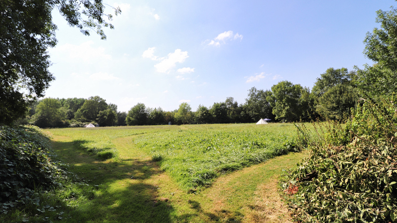 Luxury bell tent glamping field in riverside meadow at Moulin St Blaise, Loire Valley, France
